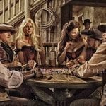 couple of gamblers sitting aorund a casino table with women next to them