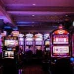 an image with a set of slot machines photographed inside of a casino