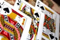the playing cards king, queen and jack next to each other