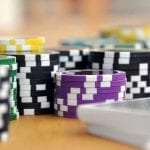 poker chips on a wooden table